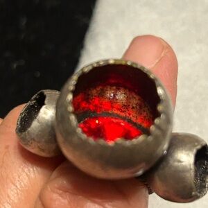 Konplott silver ring with three red sunken orbs